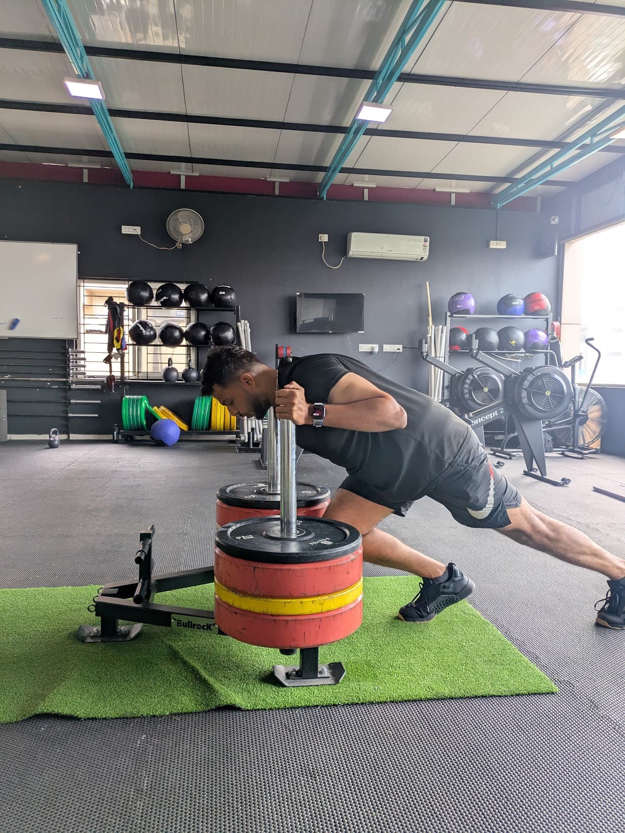 Functional fitness sled push at Xthrive HSR Layout, building real-world strength and conditioning.